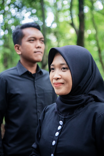 Outdoor prewedding photo of Indonesian young couple - Stock photo